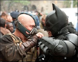 Tom Hardy as Bane and Chritian Bale as Batman in The Dark Knight Rises.