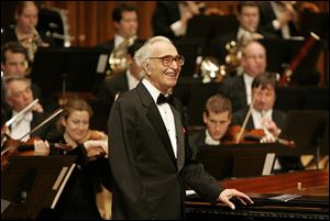 Jazz pianist Dave Brubeck at his piano as he celebrates his 85th birthday on stage at London's Barbican Hall after a performance with the London Symphony Orchestra, December, 2005.