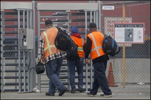 Port workers return to work at the Port of Long Beach today.