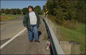 Leandre Tankersley recalls a fatal crash in 2002 at this spot on State Rt. 37, where a young mother’s car flipped over the guardrail. Ms. Tankersley held the woman’s hand as she died.