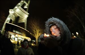 C. Nash smokes marijuana in a glass pipe just after midnight at the Space Needle in Seattle. Possession of marijuana became legal in Washington state at midnight, and several hundred people gathered at the Space Needle to smoke and celebrate the occasion, even though the new law does prohibit public use of marijuana.