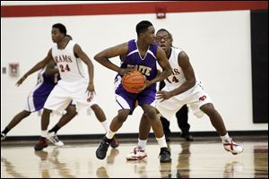 Kenyatta Bowen, of the Waite Indians, looks for a pass during the third period of their game against the Rogers Rams at Rogers.