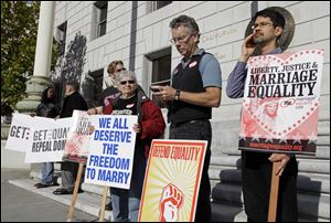 Gay marriage supporters outside the California Supreme Court in San Francisco. The Supreme Court will take up California's ban on same-sex marriage, a case that could give the justices the chance to rule on whether gay Americans have the same constitutional right to marry as heterosexuals.