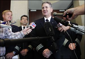 Keith Wilson, president of the Allied Pilots Association, said the six-year contract will raise pilots' pay by 4 percent on signing and 2 percent per year after that, with an adjustment in the third year to bring pay in line with that at other big airlines.