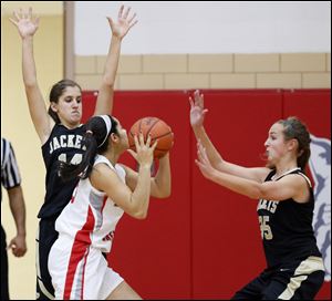 Perrysburg's Katie Dunphy (14) and Allex Brown (35) defend against  Bowling Green's Tyanna Smith (15).
