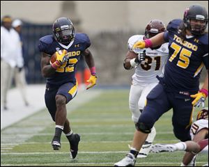 Toledo running back David Fluellen races up the sideline for a first down against Central Michigan during a 50-35 victory on Oct. 6 at the Glass Bowl. The Rockets are one of seven Mid-American Conference teams that will appear in the postseason.