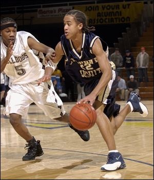 Brian Roberts, right, drives past Scott's James E. Walker during a game in 2004. Roberts is a former Blade player of the year after starring for St. John's Jesuit.