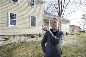 Dori Durbin says royalties from the wells across the street from her Adrian Township home are helping. 