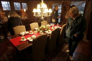 Visitors admire the dining room of the Bresnahan Home on Richmond Road during the holiday home tour hosted by the Westmoreland Homeowners Association. Scores of people showed up for the tour.