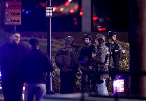 Law enforcement personnel work the scene of a shooting at the Clackamas Town Center in Clackamas, Ore.