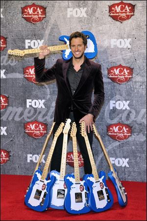 Singer Luke Bryan won everything he was nominated for, including artist and album of the year. His smash hit 