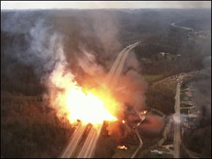 This image provided by the West Virginia State Police shows a fireball erupting across Interstate 77 from a gas line explosion in Sissonville, W. Va., Tuesday.