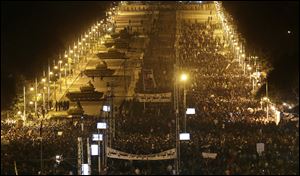 Egyptian Army tanks, left, deploy  as Egyptian protesters gather outside the presidential palace during a demonstration against President Mohammed Morsi in Cairo, Egypt, Tuesday.