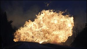 West Virginia State Police say several structures are on fire and about a mile of Interstate 77 is shut down in both directions.  