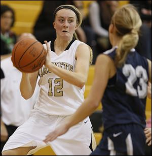 Perrysburg's Maddy Williams (12) steals the ball against Napoleon.