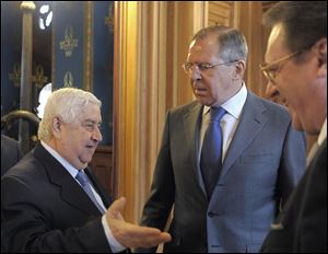 From left: Syrian Foreign Minister Walid Muallem, Russian Foreign Minister Sergey Lavrov and Russian Deputy Foreign Minister Mikhail Bogdanov meet in Moscow. Russia's deputy foreign minister Mikhail Bogdanov said Thursday.