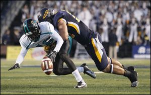 UT linebacker Dan Molls hits Coastal Carolina’s Tyrell Blanks. Molls leads the nation with 166 tackles, including 86 solo.