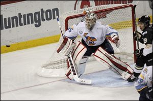 Walleye goalie Kent Simpson keeps his eye on the puck during the third period of Wednesday's game against Wheeling. He finished with 30 saves.
