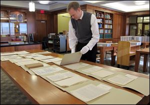 Marquette University Archivist Bill Fliss arranges some of the 11,000 J.R.R. Tolkien papers the university owns in the library of the Milwaukee school - home to the largest Tolkien collection in the world. 
