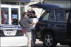 As part of the investigation authorities removed boxes of records from the International House of Pancakes restaurant on Talmadge Road in September, 2011.