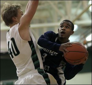 David Brown, of Ottawa Hills, shoots the ball during the fourth period of their game against Maumee Valley.
