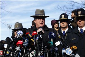 Lt. J. Paul Vance of the Connecticut State Police conducts a news briefing, Saturday.