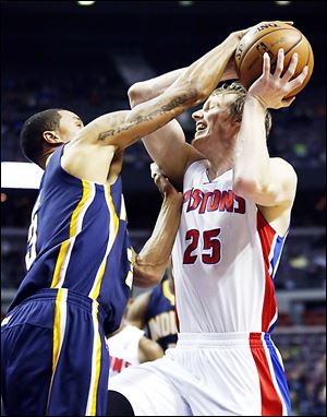 Detroit Pistons forward Kyle Singler, right, has a shot blocked by Indiana Pacers guard George Hill, whose 15 points helped sink Detroit.