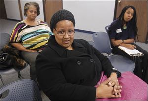 Regina Willis, 34, of Toledo, center, who is not on welfare, says that she thinks it's fair to expect welfare recipients to undergo testing for drug use. 'When you go for a job, you have to do a drug test,' she said.
