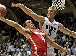Ohio State's Aaron Craft puts up a shot against Duke's Mason Plumlee last month in Durham, N.C. The loss to the Blue Devils has been the only blemish so far for the Buckeyes.