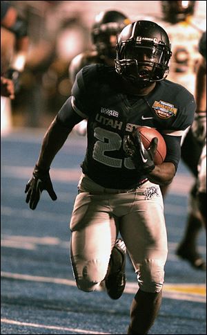 Utah State's Kerwynn Williams breaks off a long touchdown run. Williams ran for 191 yards in the fourth quarter.
