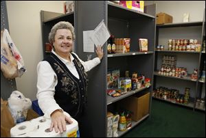 Case worker Mary Glover-Booher says the food pantry of the center in Temperance can use donations any time of year.
