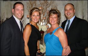 Stone Oak Country Club members Brian Schmitz and wife Brook, the Holiday Lights chairman, with Cynthia Coleman, event committee member, and her husband Jeff.
