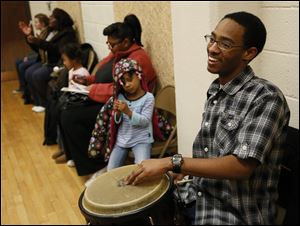 Brandon Benson, 17, plays the drums during an ethnic dance class at the Frederick Douglass Community Center.