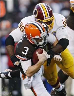 The Redskins' Barry Cofield (96) sacks the Browns' Brandon Weeden in the fourth quarter.
