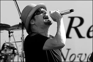 Kid Rock performs a concert before the NASCAR Sprint Cup Series championship race at Homestead-Miami Speedway in Homestead, Fla., on Nov. 18. Tickets for his Toledo show go on sale Friday.
