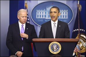 President Obama stands with Vice President Biden as he makes a statement in the Brady Press Briefing Room at the White House about policies he will pursue following the Newtown, Conn., school shootings.