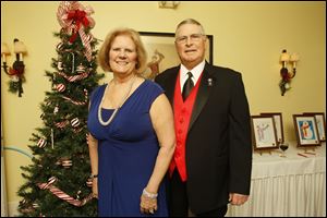 Sally and John Welch, past president of the Perrysburg Rotary Club, pose for a picture during the Perrysburg Rotary Holiday Party at Carranor Hunt and Polo Club in Perrysburg.