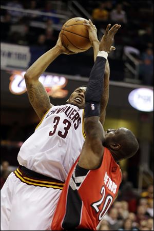 The Cavs' Alonzo Gee shoots over the Raptors' Mickael Pietrus in the second quarter.