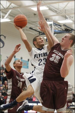 Lake senior Tyler Landis attempts to push past Rossford's junior Matt Enderbury during the second quarter of Tuesday's game at Lake.