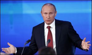 Russian President Vladimir Putin speaks during a news conference in Moscow, Russia.