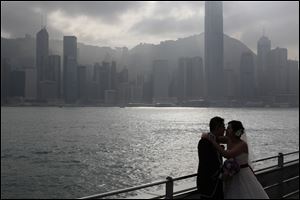 A couple poses for their wedding pictures in Hong Kong Friday Dec. 21, 2012. Many people around the world believe that the Mayan people predicted the end of the world Dec. 21. 