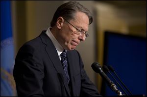 The National Rifle Association executive vice president Wayne LaPierre pauses as he makes a statement during a news conference in response to the Connecticut school shooting, on Friday.