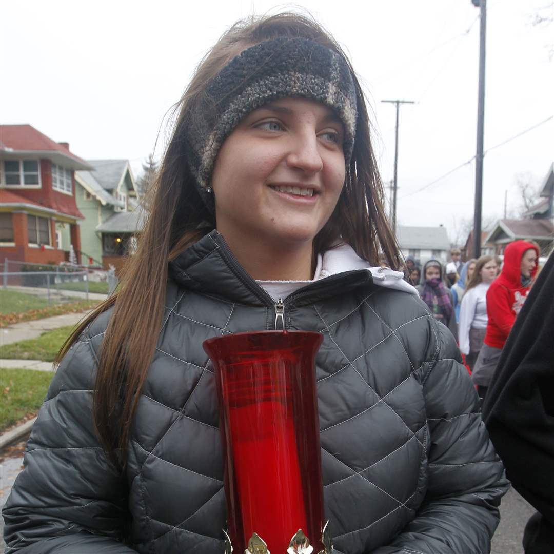 Central-Catholic-senior-Allie-Comes-carries-the-student-council-candle