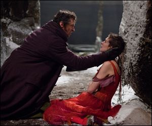 Hugh Jackman as Jean Valjean, left, and Anne Hathaway as Fantine in a scene from 