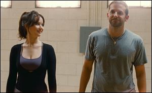 Jennifer Lawrence, left, and Bradley Cooper in 