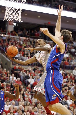 Ohio State's Sam Thompson scores in front of Kansas' Jeff Withey today in Columbus.