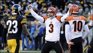 Cincinnati's Josh Brown celebrates hitting a 43-yard field goal with four seconds left to beat Pittsburgh and send the Bengals to the playoffs for a second straight season.
