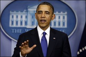 President Obama speaks to reporters about the fiscal cliff in the Brady Press Briefing Room at the White House in Washington, Friday.