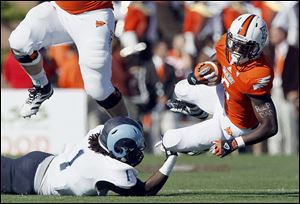 Bowling Green's Anthon Samuel has run for almost 1,000 yards this season. Against Rhode Island, he honored his father on his arm.