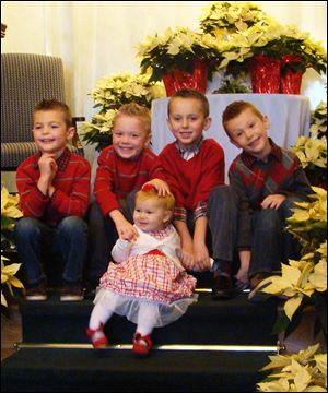 Blaine Schmitz, Will Coleman, Jack Coleman, Beckham Schmitz and little Madeline Coleman, front, children of Brooke and Brian Schmitz and Cynthia and Jeff Coleman, look forward to their time with Santa at Stone Oak Country Club.